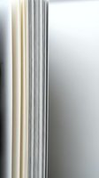 Stack of white paper sheets with visible edges creating layered texture for office and business documentation concepts.