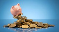 Pink piggy bank sitting on pile of golden coins against blue gradient background for savings and financial planning concepts.