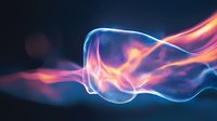 Glowing abstract wave lines in blue and orange colors flowing on dark background create dynamic motion effect for technology and science designs.