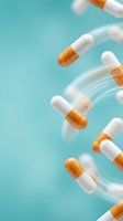 Orange and white pharmaceutical capsules floating with motion blur on turquoise background for healthcare and medicine concepts.