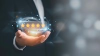 Businessman holding glowing five-star rating sphere with digital particles, representing customer satisfaction, feedback, and quality service excellence for business and marketing.