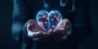 Glowing digital heart shape formed by connected dots and lines floating above cupped hands against dark background, symbolizing technology and human connection.