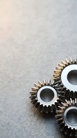 Metal gear wheels on concrete surface for industrial engineering and manufacturing concepts with copy space for text.