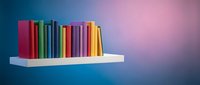 Colorful books arranged on white floating shelf against gradient blue to pink background for education and learning concepts.
