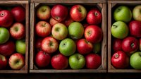 Fresh red and green apples arranged in rustic wooden crates, showcasing natural color contrast and farm-fresh produce for healthy eating and market display.
