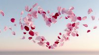 Flying pink rose petals forming heart shape against soft sky background for romantic wedding Valentine's Day greeting cards and love celebration designs.