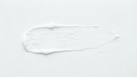 White cream or lotion smear on neutral background, isolated texture sample for cosmetic, skincare, and beauty product design applications.