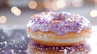 Purple glazed donut with colorful sprinkles on reflective surface against blurred bokeh lights background, close up macro food photography with soft focus.