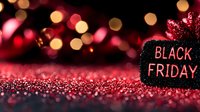 Black Friday sale sign on glittering red background with golden bokeh lights creating festive shopping atmosphere for seasonal promotions and discounts.