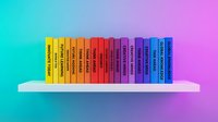 Colorful books arranged on white shelf against gradient cyan to magenta background, representing education, learning, library collection, and reading materials for design projects.