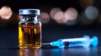 Medical vial with amber liquid and blue syringe on dark background with bokeh lights, dramatic medical concept for pharmaceutical and healthcare industry.