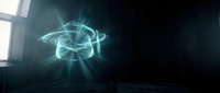 Futuristic holographic brain projection glowing with cyan light rays in dark room with window light creating sci-fi atmosphere for technology concepts.