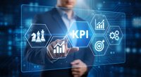 Professional businessman touching holographic KPI dashboard with performance metrics and analytics icons on futuristic digital interface background.