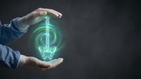 Hands protecting glowing green lightbulb hologram representing innovation, energy efficiency, environmental protection and sustainable technology solutions.