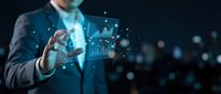 Businessman in suit interacting with glowing digital holographic charts and graphs, representing data analysis, financial growth, and technology innovation in business environment.