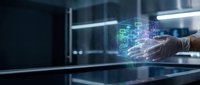 Technologist in white gloves interacting with holographic data visualization on glass surface in modern office environment for digital transformation and innovation concepts.