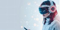 Young Asian woman wearing virtual reality headset and headphones against light background with glowing digital particles and smartphone in hand.