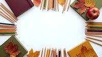 Back to school supplies arranged in circle with autumn leaves, apples, notebooks and colored pencils on white background for educational design projects.