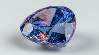 Brilliant blue diamond gemstone with colorful light reflections on isolated background, showcasing luxury facets and premium cut for jewelry design.