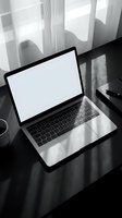 Modern laptop with blank white screen on dark wooden desk near window with natural sunlight and shadows for business mockup presentations.