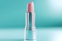 Pink lipstick in silver tube on turquoise gradient background for cosmetics and beauty product advertising campaigns.