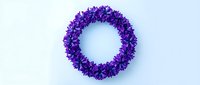 Purple flower wreath on white background for spring decoration, wedding design, greeting cards, and seasonal crafts projects.