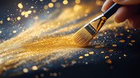 Paint brush sweeping golden glitter dust on dark background with magical bokeh light effect and sparkles creating artistic composition.