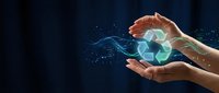 Hands protecting glowing recycling symbol with digital network connections on dark blue background representing environmental sustainability and green technology.