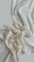 Elegant white silk fabric with soft folds and gentle waves creating luxurious texture and flowing movement against neutral background, suitable for wedding and fashion designs.