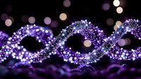 Abstract purple glowing particle waves flowing in elegant curves against dark background with bokeh lights creating magical digital energy pattern.
