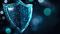 Glowing blue shield with sparkles on dark background, digital security concept visualization with bokeh light effects and particles for cybersecurity designs.