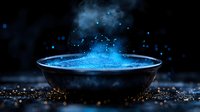 Mystical glowing blue powder explosion in dark bowl with floating particles and smoke creating magical atmospheric effect. Suitable for fantasy or cosmetic designs.