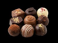 Assorted chocolate truffles and bonbons isolated on transparent background, ready for confectionery packaging, recipe blogs, bakery designs, print-on-demand products, and culinary marketing materials.