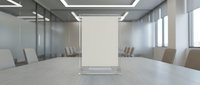 Modern conference room with blank presentation board and chairs around table for business meetings and corporate presentations.