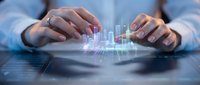 Businessman hands protecting holographic financial charts and data analytics on digital tablet for investment strategy and market analysis.