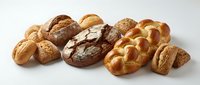 Assorted fresh baked breads and rolls including sourdough, whole wheat, and braided loaves isolated on white background for bakery, food, and culinary design.