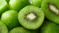 Fresh green kiwi fruit slices with seeds and pulp, healthy organic tropical food for smoothies, desserts and natural nutrition concepts.