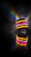 Glowing neon hamburger with vibrant rainbow light beams and reflection on dark surface for creative food advertising and restaurant marketing concepts.