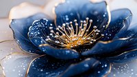 Elegant navy blue and gold flower with sparkling details and delicate petals in close-up macro shot against light background, artistic floral composition.