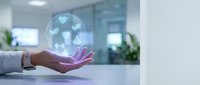 Hand holding glowing digital sphere with heart icons, representing healthcare, charity, and compassionate medical services for wellness and support.