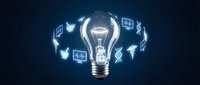 Glowing light bulb surrounded by floating social media and technology icons on dark blue background for digital marketing and innovation concepts.