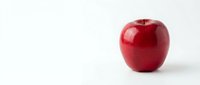Red apple with glossy skin isolated on white background, suitable for health, nutrition, and food-related design projects.