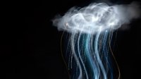 Glowing jellyfish with translucent bell and flowing blue tentacles against dark background. Marine life bioluminescence concept for science education materials.