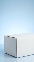 White cardboard box on blue gradient background for product packaging mockup and commercial presentation needs.