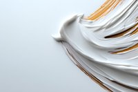 Luxurious white cream swirls with golden metallic accents on light background, cosmetic texture close-up showing smooth flowing curves and rich moisturizing consistency.