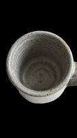 Rustic handmade ceramic mug with speckled glaze, isolated on transparent background. Ready for stickers, print on demand, clipart, and T-shirt design use.