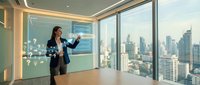 Professional businesswoman presenting data analytics on interactive display in modern corporate boardroom with city skyline view during daytime meeting.