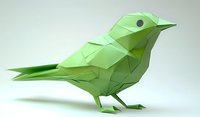 Low poly green bird figure in geometric style on light background, modern minimalist art sculpture with angular surfaces and clean lines creates striking decorative piece.