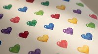 Colorful heart pattern with rainbow hearts in red, blue, green, yellow, purple scattered on white background for romantic designs and love themes.