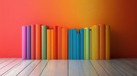 Row of colorful books standing on wooden floor against vibrant red-orange gradient wall background, creating minimalist composition with rainbow spectrum spines.